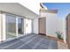 Private patio with sliding glass door and outdoor carpeting offers a relaxing outdoor retreat at 7765 W Glenn Dr, Glendale, AZ 85303