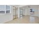 Bedroom featuring tile flooring, a ceiling fan, and a mirrored closet at 7765 W Glenn Dr, Glendale, AZ 85303