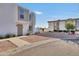 Charming townhome exterior with well-maintained landscaping and ample parking at 7765 W Glenn Dr, Glendale, AZ 85303