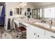Bathroom with double vanity sinks, granite counters, and a glass enclosed shower at 7908 W Rose Garden Ln, Peoria, AZ 85382