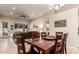 Dining area with a large table, tile flooring, and easy access to the living area at 7908 W Rose Garden Ln, Peoria, AZ 85382
