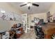 Office area features a whiteboard, french doors, and a dark wood roll-top desk at 7908 W Rose Garden Ln, Peoria, AZ 85382