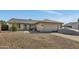 Inviting single-level home featuring xeriscaping, a covered entryway, and an attached two-car garage at 8137 W Wood Dr, Peoria, AZ 85381