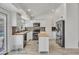Bright kitchen featuring white cabinets, stainless steel appliances, wood countertops, and unique flooring at 8137 W Wood Dr, Peoria, AZ 85381