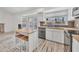Bright kitchen featuring white cabinets, stainless steel appliances, wood countertops, and unique flooring at 8137 W Wood Dr, Peoria, AZ 85381