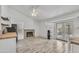 Bright living room featuring neutral walls, stylish flooring, and vaulted ceilings with a fireplace at 8137 W Wood Dr, Peoria, AZ 85381