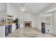 Bright living room featuring neutral walls, stylish flooring, and vaulted ceilings with a fireplace at 8137 W Wood Dr, Peoria, AZ 85381