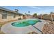 Backyard view with in-ground pool, patio area, and well-maintained lawn at 8137 W Wood Dr, Peoria, AZ 85381