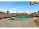 Private backyard showcasing an in-ground pool and lush landscaping at 8137 W Wood Dr, Peoria, AZ 85381