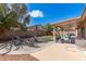 An outdoor fire pit with seating, patio, artificial turf, and covered seating provide an inviting outdoor area at 8535 W Willow Ave, Peoria, AZ 85381