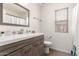 Modern bathroom featuring updated vanity with a framed mirror and fixtures at 8535 W Willow Ave, Peoria, AZ 85381