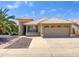 Inviting single-Gathering home featuring a two-car garage, tiled roof, desert landscaping and mature palm tree at 8535 W Willow Ave, Peoria, AZ 85381