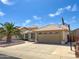 Single-Gathering home featuring a two-car garage, tiled roof, mature palm tree and basketball hoop on the driveway at 8535 W Willow Ave, Peoria, AZ 85381