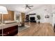 Open-concept living room featuring modern furniture, neutral tones, and wood flooring at 8535 W Willow Ave, Peoria, AZ 85381