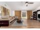 Open-concept living room featuring modern furniture, neutral tones, and wood flooring at 8535 W Willow Ave, Peoria, AZ 85381