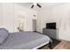 Spacious main bedroom with neutral colors, ceiling fan and views to the en-suite bathroom at 8535 W Willow Ave, Peoria, AZ 85381