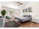 Airy main bedroom featuring a bay window, ceiling fan, and a comfortable aesthetic at 8535 W Willow Ave, Peoria, AZ 85381