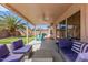 Covered patio featuring an outdoor living area and lush landscaping at 8535 W Willow Ave, Peoria, AZ 85381