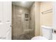 Tiled shower with a glass door and built in niche in this tastefully designed bathroom at 9340 N 92Nd St # 120, Scottsdale, AZ 85258
