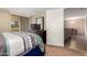 Bedroom with a view to the living room and slider door to the outside at 9340 N 92Nd St # 120, Scottsdale, AZ 85258