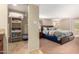 Spacious bedroom with a walk-in closet, plush carpet, and natural light at 9340 N 92Nd St # 120, Scottsdale, AZ 85258