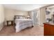 Bedroom with carpet, slider to outside and a closet at 9340 N 92Nd St # 120, Scottsdale, AZ 85258