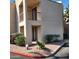 Exterior view of condo featuring balcony, desert landscaping, and neutral color scheme at 9340 N 92Nd St # 120, Scottsdale, AZ 85258