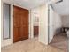 Interior shot of the entryway with a decorative glass window and bathroom access at 9340 N 92Nd St # 120, Scottsdale, AZ 85258