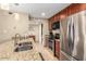 Well-lit kitchen featuring stainless steel appliances and granite countertops at 9340 N 92Nd St # 120, Scottsdale, AZ 85258