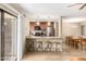 Cozy kitchen featuring a breakfast bar with granite countertops and stainless steel appliances at 9340 N 92Nd St # 120, Scottsdale, AZ 85258