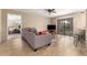 Living area featuring sliding glass doors, bar seating and tile flooring throughout at 9340 N 92Nd St # 120, Scottsdale, AZ 85258