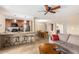 Open-concept living room and kitchen featuring tile flooring and a comfortable seating area at 9340 N 92Nd St # 120, Scottsdale, AZ 85258