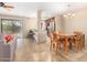 Open concept living and dining area with access to kitchen and outdoor patio at 9340 N 92Nd St # 120, Scottsdale, AZ 85258