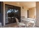 A quaint patio with a table and chairs provides a relaxing outdoor setting at 9340 N 92Nd St # 120, Scottsdale, AZ 85258