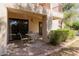 A covered patio with seating offers a relaxing outdoor space at 9340 N 92Nd St # 120, Scottsdale, AZ 85258