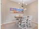 Charming dining area with seating for four and stylish lighting, perfect for Gathering meals at 1085 W Ayrshire Trl, San Tan Valley, AZ 85143