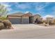 Charming single-story home featuring a three-car garage and well-maintained landscaping at 1085 W Ayrshire Trl, San Tan Valley, AZ 85143