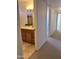 Bathroom with wood vanity, decorative mirror, and tiled floors at 11038 N 53Rd Dr, Glendale, AZ 85304