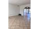 Bright living room features neutral walls, tiled floors, arched doorway, and natural light at 11038 N 53Rd Dr, Glendale, AZ 85304