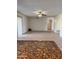 Spacious living room with neutral walls, tiled floors, ceiling fan, and natural light at 11038 N 53Rd Dr, Glendale, AZ 85304