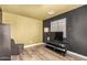 Bedroom showing a dark accent wall with entertainment center at 12517 W Santa Fe Ln, El Mirage, AZ 85335