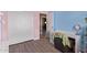 Stylish bedroom featuring wood floors, an attached closet, and colorful walls at 12517 W Santa Fe Ln, El Mirage, AZ 85335