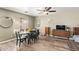 Dining area with wood floors and natural light at 12517 W Santa Fe Ln, El Mirage, AZ 85335