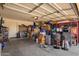 Spacious garage interior with ample storage space, shelving, and room for parking and organization at 12517 W Santa Fe Ln, El Mirage, AZ 85335