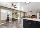 Kitchen with an island, eating area and view to patio at 12517 W Santa Fe Ln, El Mirage, AZ 85335