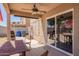 Covered patio with ceiling fan, dining table, and grill, perfect for outdoor dining at 12517 W Santa Fe Ln, El Mirage, AZ 85335