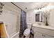 Cozy bathroom featuring a shower-tub combo with stylish curtain and vanity at 1425 E Desert Cove Ave # 35, Phoenix, AZ 85020