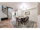 Elegant dining area with a spiral staircase and a table set for six at 1425 E Desert Cove Ave # 35, Phoenix, AZ 85020