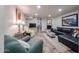 Cozy living area with fireplace, comfortable seating, and ample lighting at 1425 E Desert Cove Ave # 35, Phoenix, AZ 85020