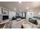 Comfortable living room featuring a fireplace, leather sectional and neutral decor at 1425 E Desert Cove Ave # 35, Phoenix, AZ 85020